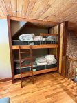 The loft has built in bunk beds.